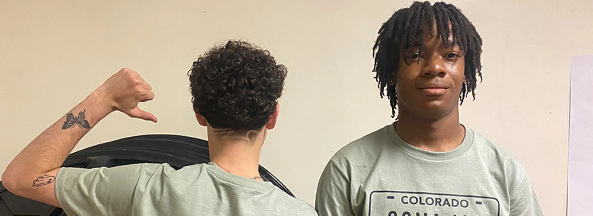 two teens posing in t-shirts